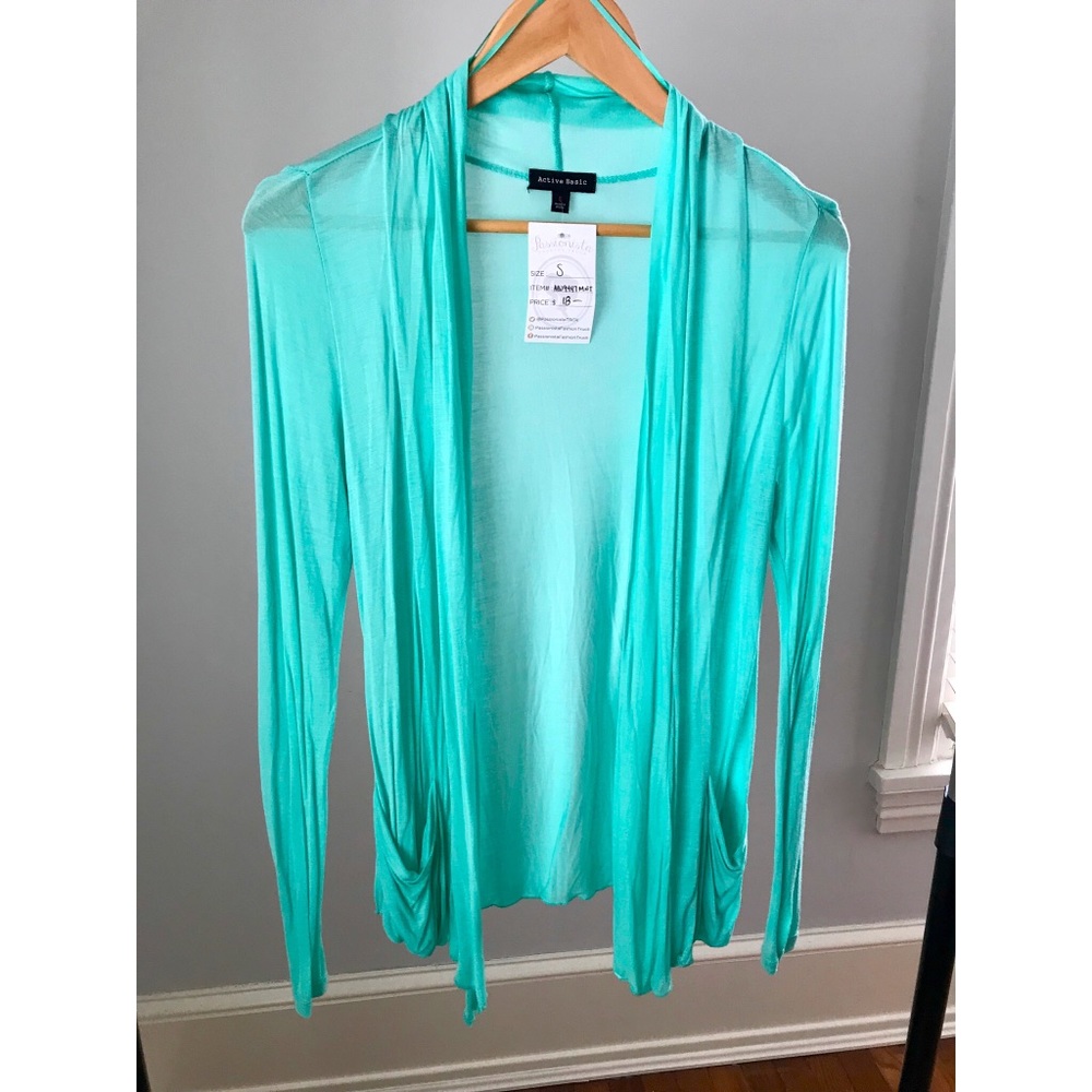 Teal cardigan with small nick on the left sleeve
